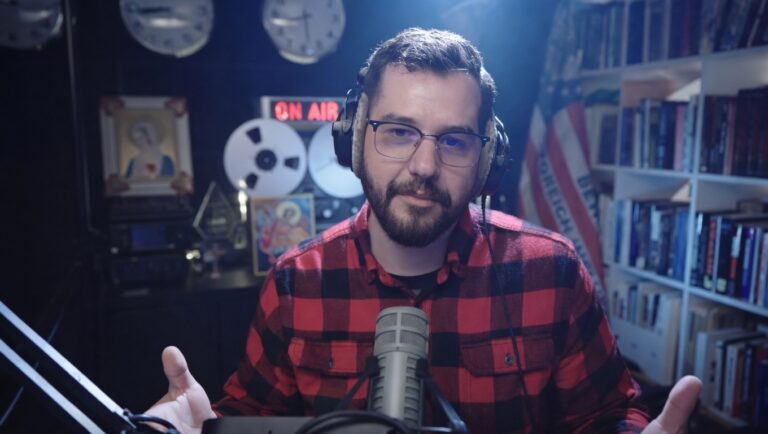 Dave Reilly on his podcast looking at the screen.